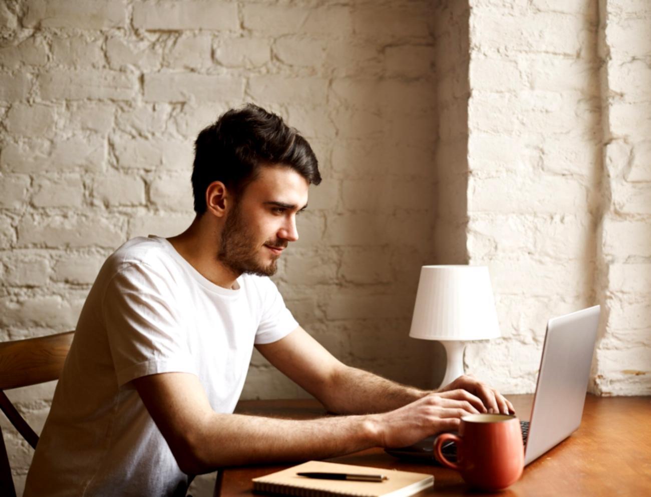 Well-organized home study environment with financial learning materials and proper lighting setup