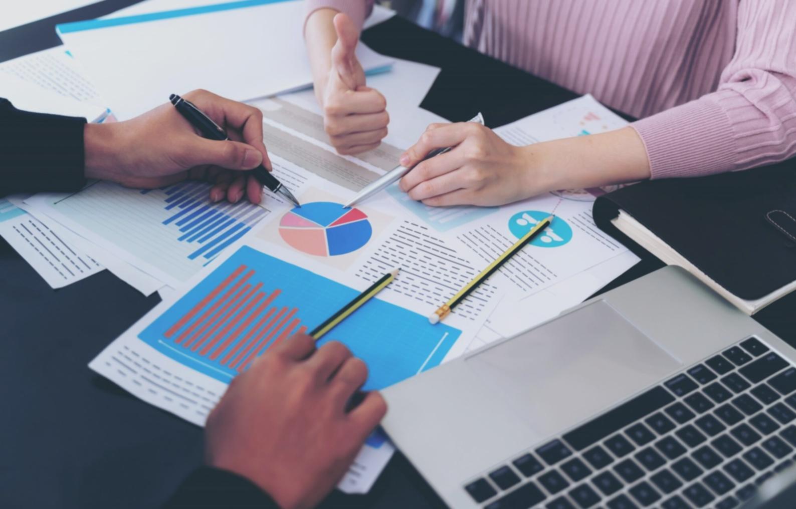 Financial charts and analysis tools displayed on computer screen